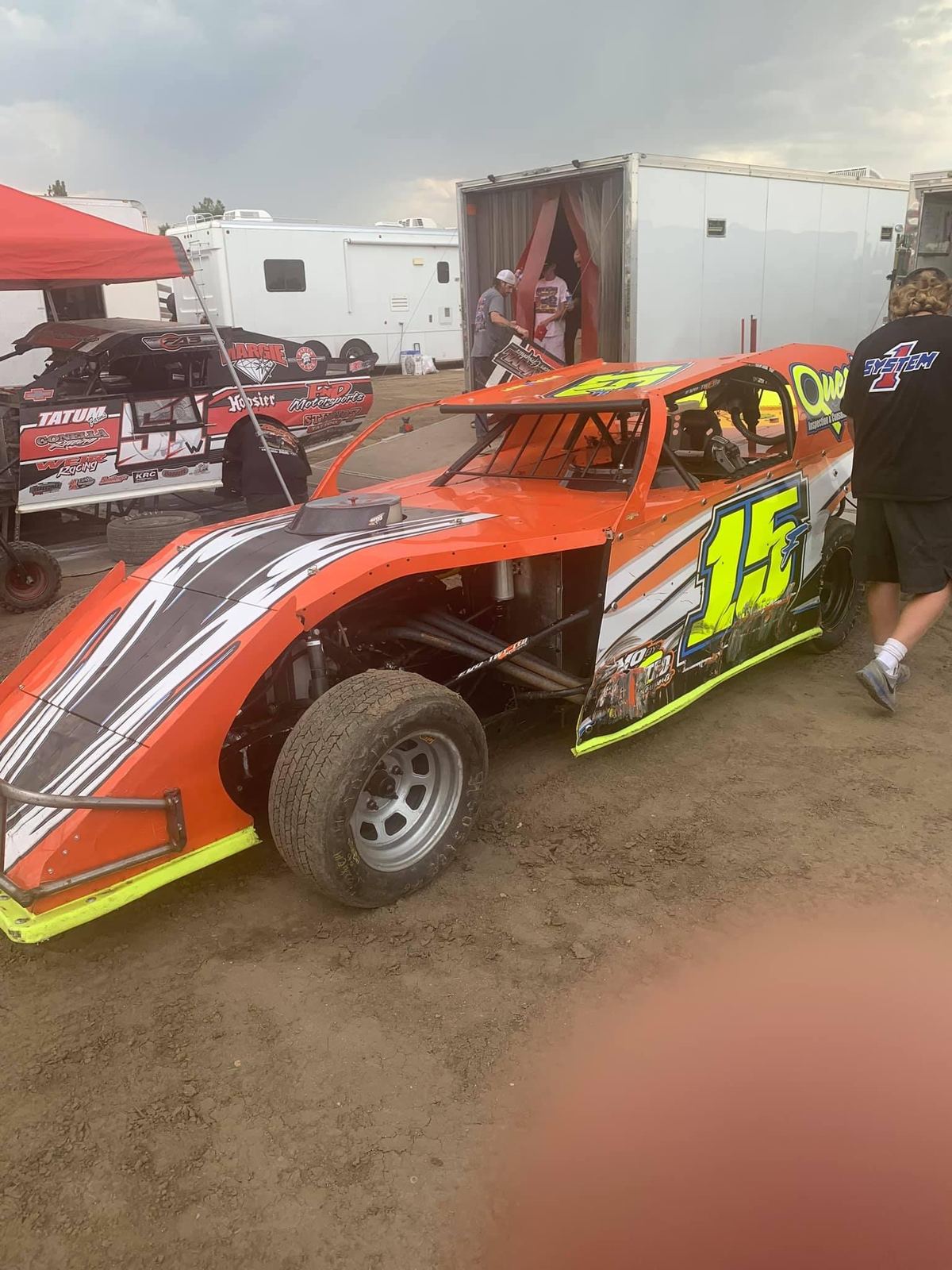 The orange #15F Modified in the pits pre-race